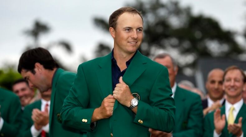 Jordan Spieth wears his green jacket after winning the Masters golf tournament Sunday, April 12, 2015, in Augusta, Ga. (AP Photo/David J. Phillip)