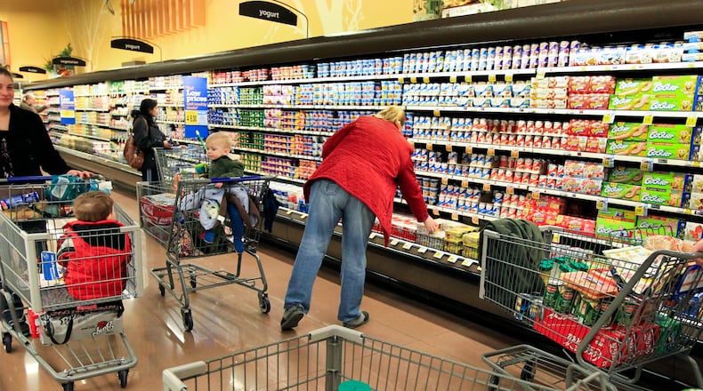 A file photo shows shoppers at Kroger at Austin Landing. FILE