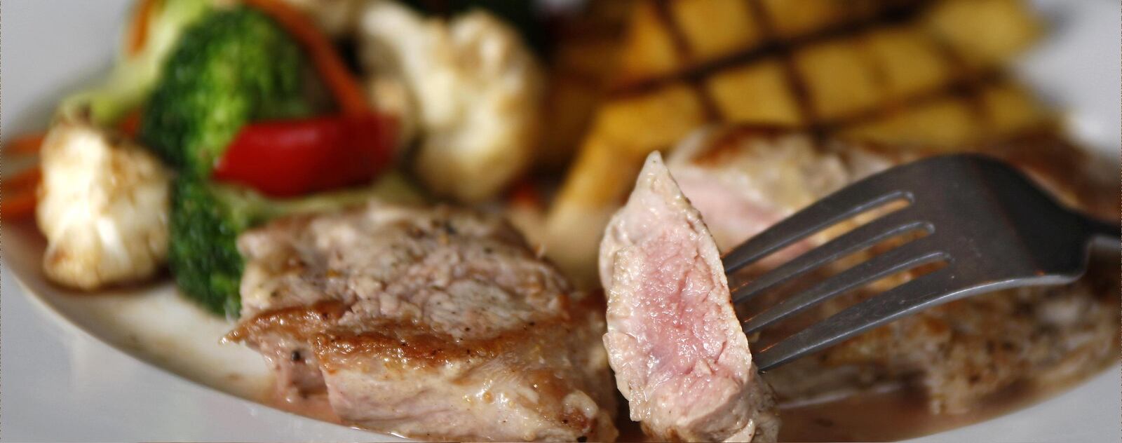 Meadowlark Restaurant, 5531 Far Hills Ave., makes a dish called "Pork Jezebel" which includes a pork tenderloin cooked to the pink side of medium in line with new federal guidelines. STAFF PHOTO BY JAN UNDERWOOD