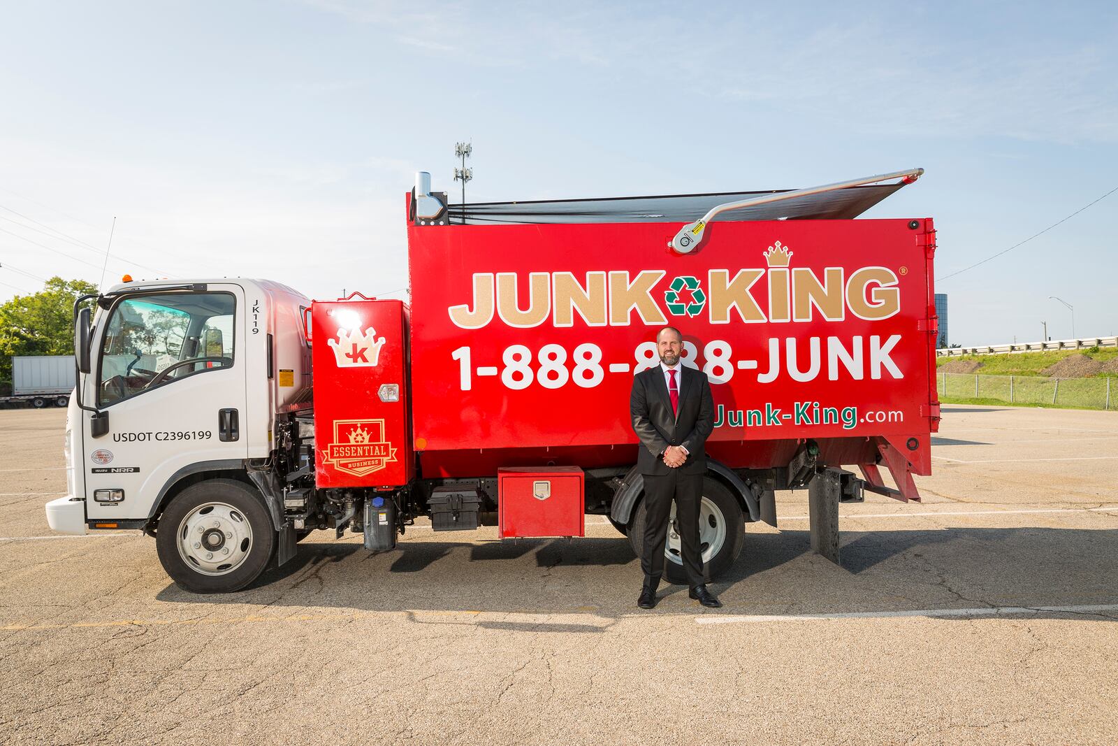 Jack Brendamour with one of the Junk King trucks. He took over leadership and part ownership of the company after his friend and mentor, Peter McCreary, passed away suddenly in 2018.