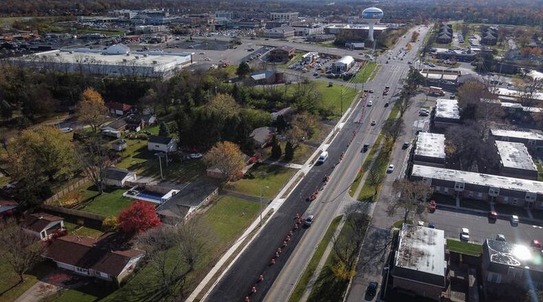 Final paving for the County Line Road widening project started Wednesday. The joint project between Beavercreek and Kettering began in June 2021 and is expected to be completed in September. JIM NOELKER/STAFF