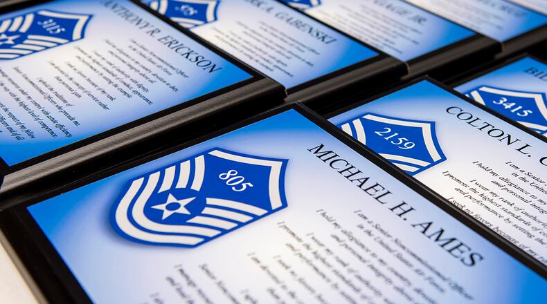 Plaques display the names and line numbers of Airmen promoted to master sergeant during the Senior Noncommissioned Officer Induction Ceremony on July 23 at Wright-Patterson Air Force Base. U.S. AIR FORCE PHOTO/WESLEY FARNSWORTH