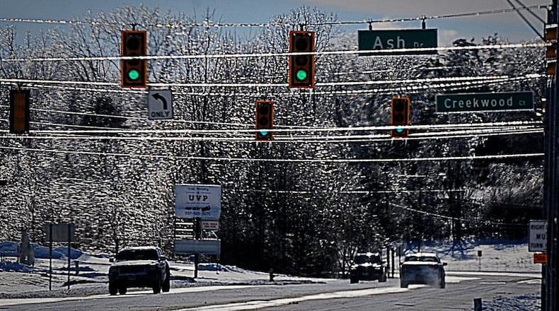 Trees and lines sparkle as they are covered with ice on Upper Valley Pike Sunday. Photo Marshall Gorby