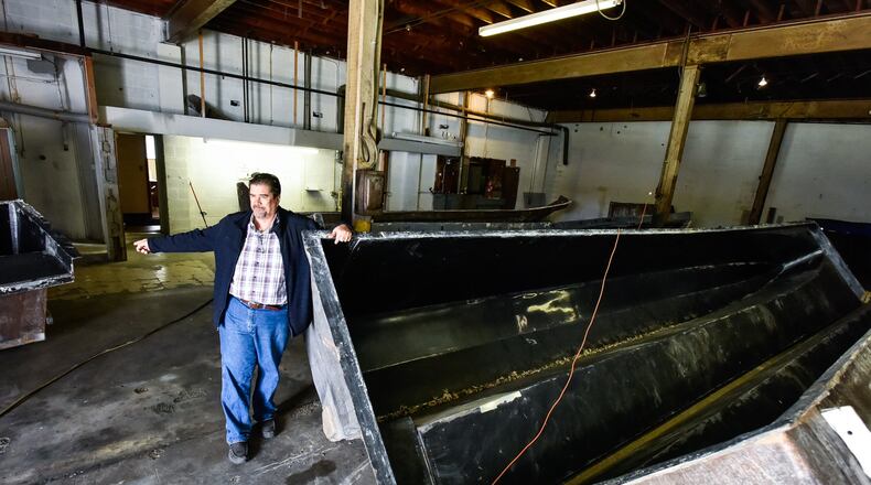 Water Taxi Marine recently bought a building on Forest Avenue in Hamilton to construct boats. Owner Todd Allmand started in the boat business with his dad in Miami, Florida but moved to Ohio due to lower freight cost when shipping his boats, some of which are nearly forty feet long and twelve feet wide. This is a mold that will be used to construct a fiberglass hull for a catamaran. NICK GRAHAM/STAFF