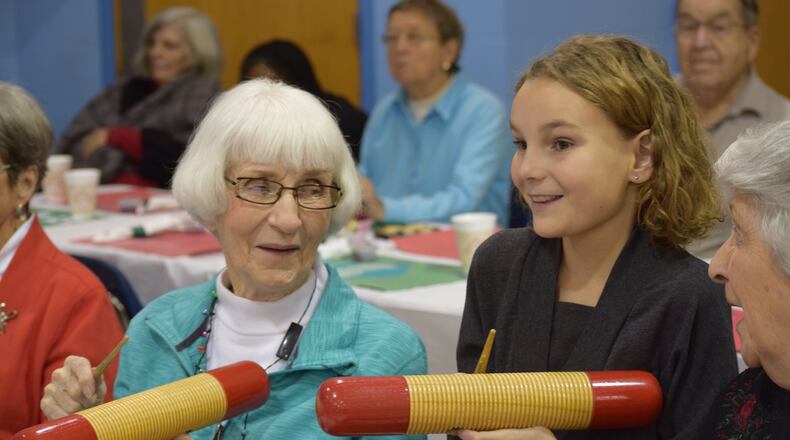 Area senior citizens celebrate the holidays with their neighbors at Western Row Elementary on Dec. 13, 2016. The Miami Valley has an increasing number of ctizens over the age of 65. CONTRIBUTED