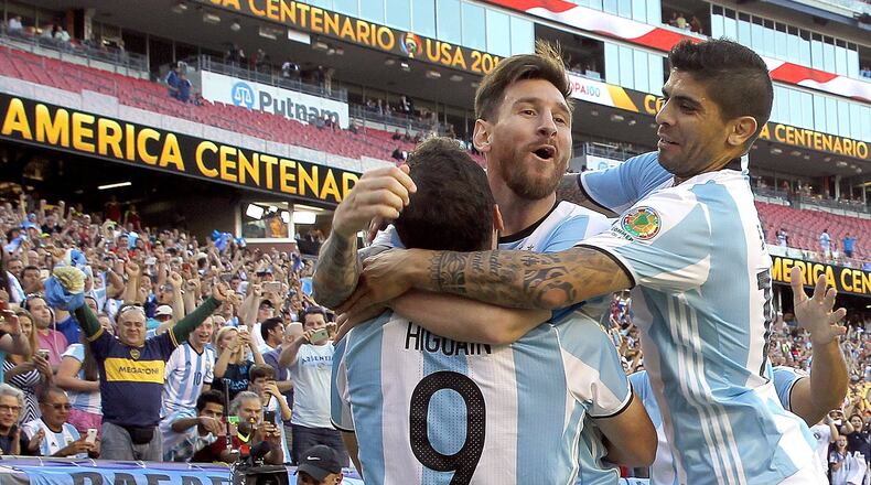 Gonzalo Higuain, left, of Argentina, celebrates his goal with Lionel Messi, center, and Ever Banega in the first half during the 2016 Copa America Centenario quarterfinal match against Venezuela at Gillette Stadium on June 18, 2016 in Foxboro, Massachusetts. (Photo by Jim Rogash/Getty Images)