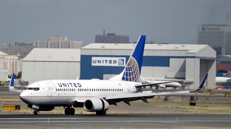 In this Sept. 8, 2015, file photo, a United Airlines passenger plane lands at Newark Liberty International Airport in Newark, N.J. United said on Monday, March 27, 2017, that regular-paying fliers are welcome to wear leggings aboard its flights, even though two teenage girls were barred by a gate agent from boarding a flight from Denver to Minneapolis Sunday because of their attire. (AP Photo/Mel Evans, File)