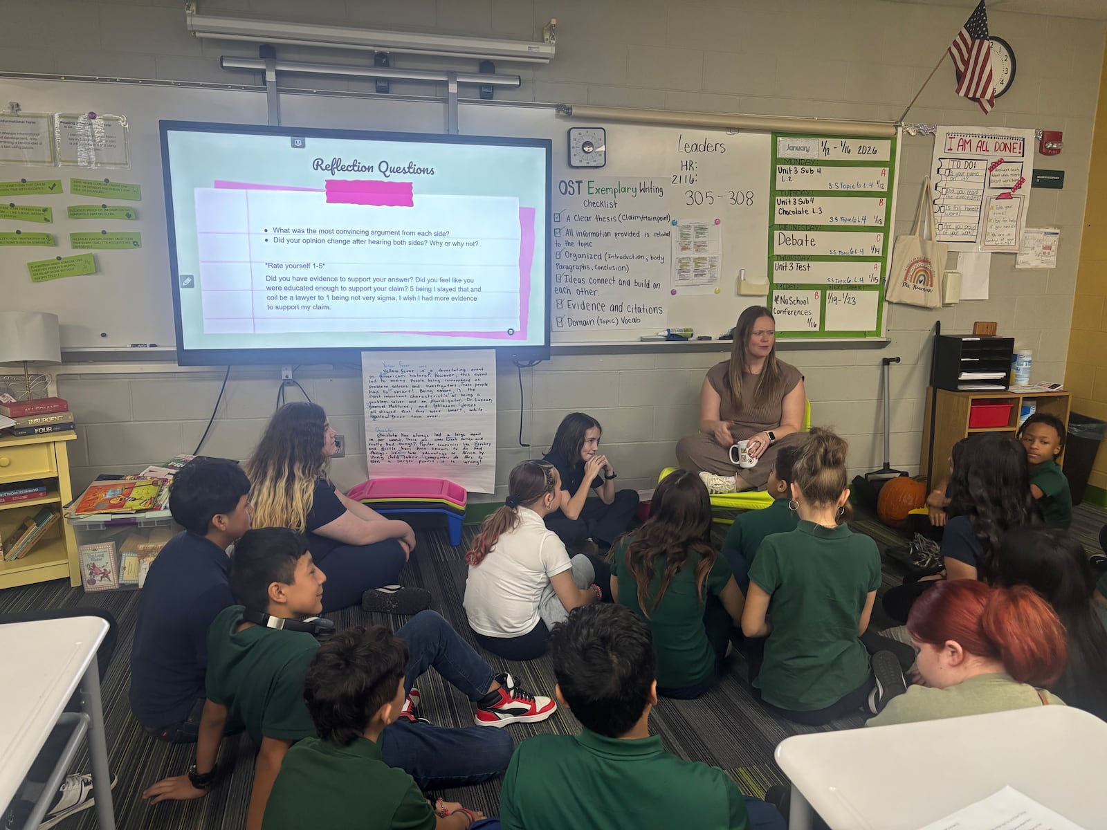 Students in Mrs. Neumann's sixth grade class at Cleveland Elementary debrief after a class debate over chocolate being included in school lunches. Eileen McClory / staff