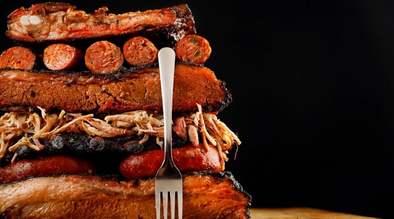 Brisket, ribs, sausage, and pulled pork are piled high, Thursday, July 12, 2018. Barbecue can be part of the keto diet. (Food styling by Michael Hamtil) (Tom Fox/The Dalals Morning News/TNS)