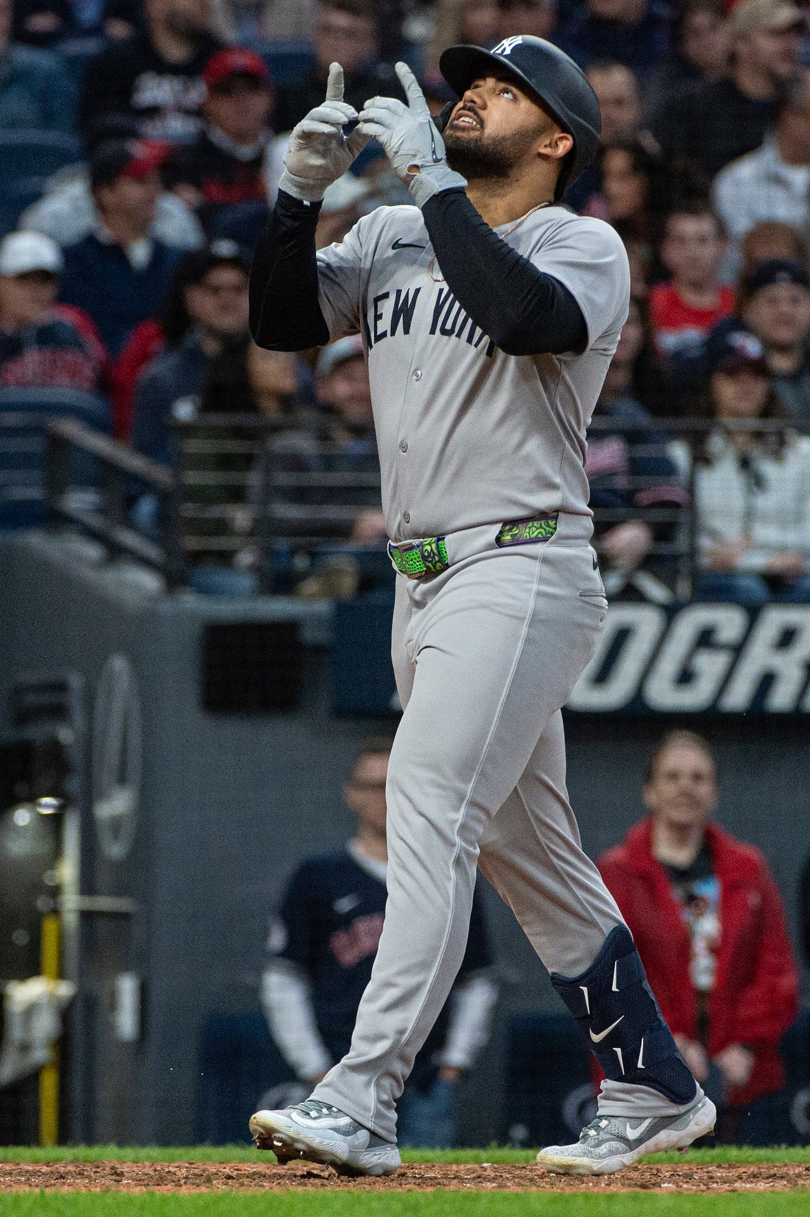 New York Yankees' Jasson Dominguez celebrates after his two-run home run off Cleveland Guardians starting pitcher Gavin Williams during the seventh inning of a baseball game in Cleveland, Monday, April 21, 2025. (AP Photo/Phil Long)