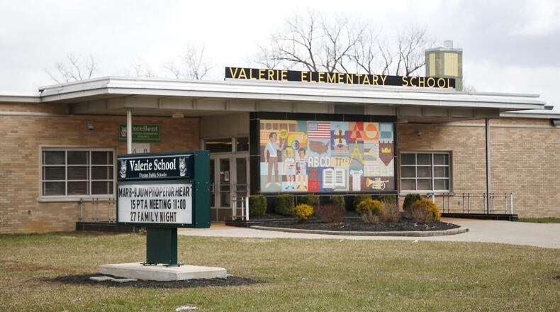 Dayton Public Schools is moving ahead with a plan to close and demolish Valerie Elementary School and move students to Meadowdale Elementary. Some Meadowdale Elementary students would be relocated to other schools to make room. TY GREENLEES / STAFF