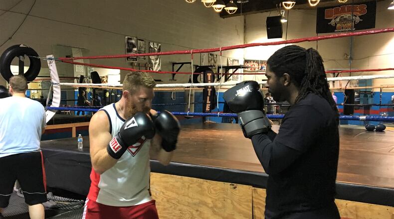 Mike Asher (left) and other fighters train for the Fighting Chance Boxing event at Drake’s Downtown Gym. KATIE WEDELL/STAFF