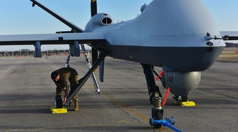 A U.S. Air Force crew chief assigned to the174th Attack Wing, performs post-flight maintenance on an MQ-9 Reaper on Mar. 10, 2025 at Springfield-Beckley Air National Guard Base in Springfield. (U.S. Air National Guard photo by Shane Hughes)