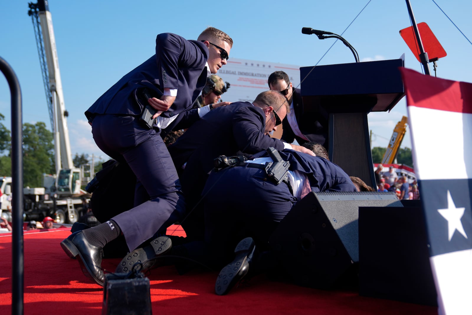 FILE - Republican presidential candidate former President Donald Trump is covered by U.S. Secret Service agents at a campaign rally, July 13, 2024, in Butler, Pa. (AP Photo/Evan Vucci, File)