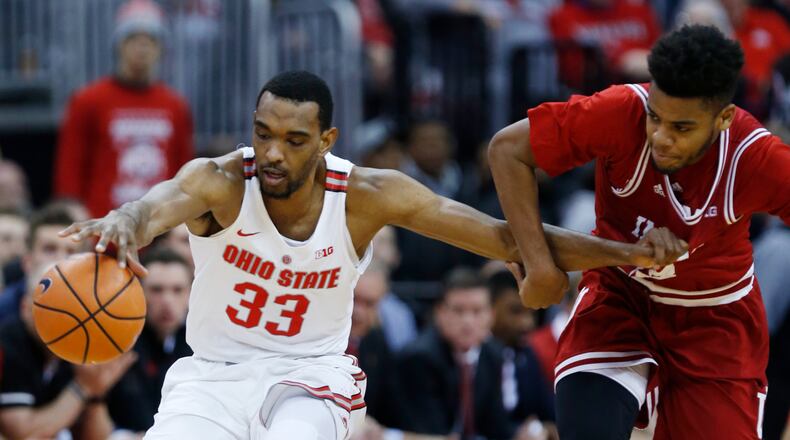 Ohio State forward Keita Bates-Diop, left, chases a loose ball against Indiana forward Juwan Morgan during the first half of an NCAA college basketball game in Columbus, Ohio, Tuesday, Jan. 30, 2018. (AP Photo/Paul Vernon)