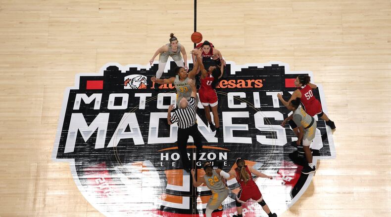 Wright State’s Tyler Frierson (33) jumps for the opening tip against IUPUI’s Tamya Sims during a Horizon League tournament semifinal on Monday, March 11, 2019, at Little Caesars Arena in Detroit. Jose Juarez/CONTRIBUTED