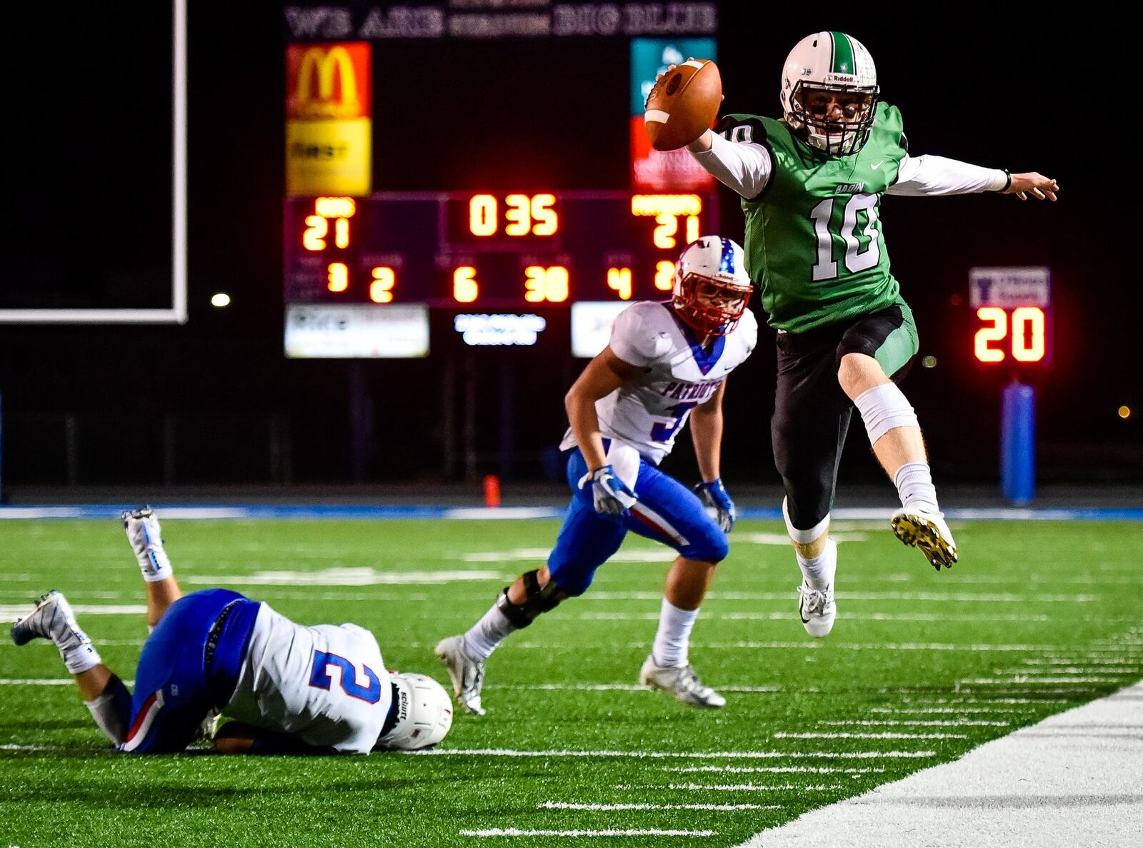 Badin quarterback Zach Switzer jumps out of bounds for a first down Friday night during the Ram’s homecoming game against Carroll at Hamilton’s Virgil Schwarm Stadium. NICK GRAHAM/STAFF
