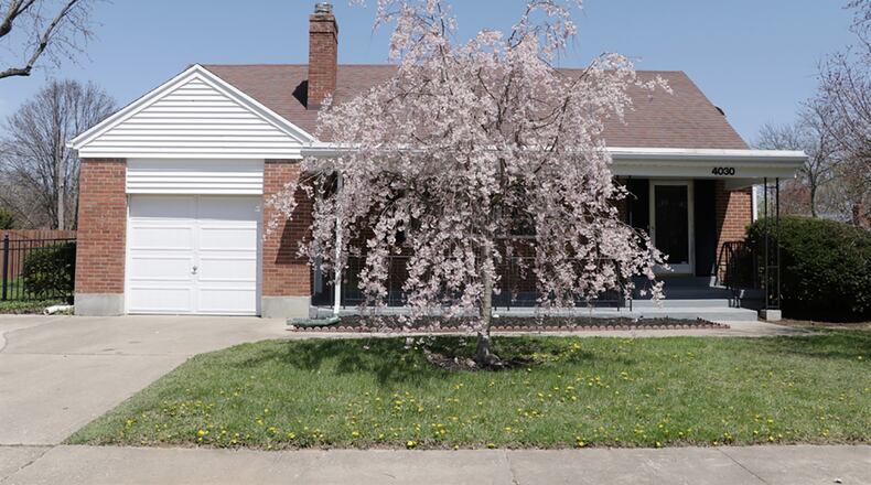 The 3-bedroom home with about 1,580 sq. ft. of living space sits on an irregular lot with large side yards that are surrounded by a wrought-iron fence. At the front, a covered front porch provided formal entry into the house. CONTRIBUTED PHOTO BY KATHY TYLER