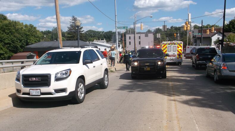 Police and EMS crews respond to the scene where two high school athletes were struck by a vehicle. CONTRIBUTED