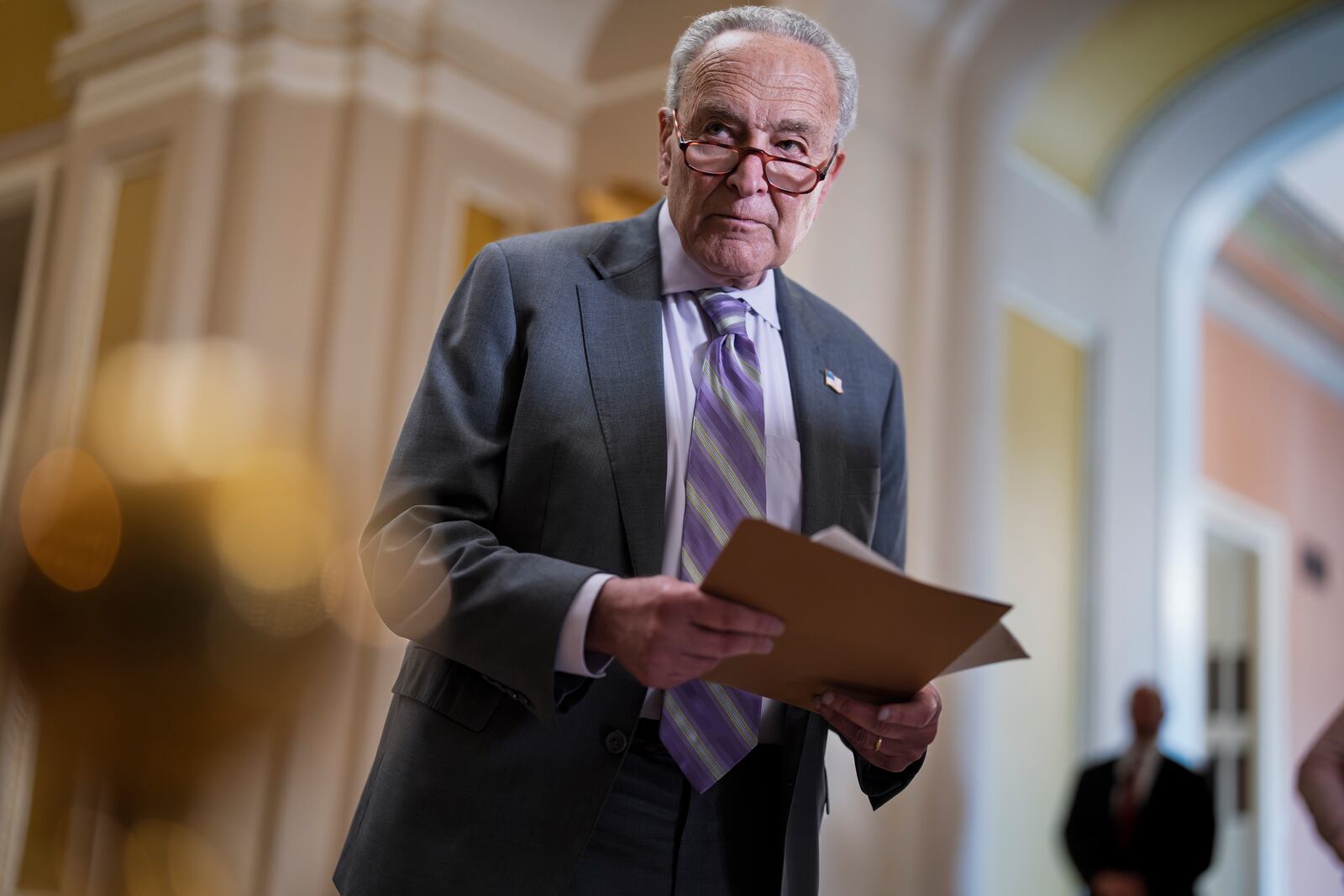 Senate Minority Leader Chuck Schumer, D-N.Y., looks over notes as Senate Republicans work to cancel $9.4 billion in previously approved spending targeted by DOGE, at the Capitol in Washington, Tuesday, July 15, 2025. (AP Photo/J. Scott Applewhite)