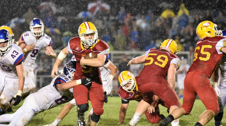 Fenwick’s Jack Fessler cuts through the Clinton-Massie defense during last Friday night’s game at Krusling Field in Middletown. C-M held on for a 21-18 victory. CONTRIBUTED PHOTO BY ANGIE MOHRHAUS