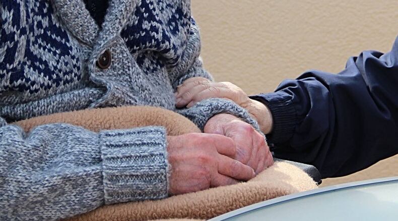 Residents isolated at a Texas nursing home posted photos of themselves on Facebook holding signs to their families.
