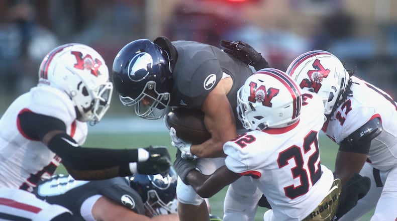 Wayne's Logan Doty runs against Fairmont on Friday, Sept. 19, 2025, at Roush Stadium in Kettering. David Jablonski/Staff