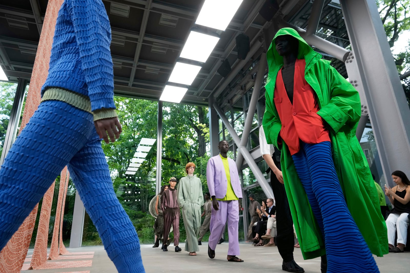 Models wear creations part of the Issey Miyake men's Spring-Summer 2026 collection, that was presented in Paris Thursday, June 26, 2025. (AP Photo/Michel Euler)