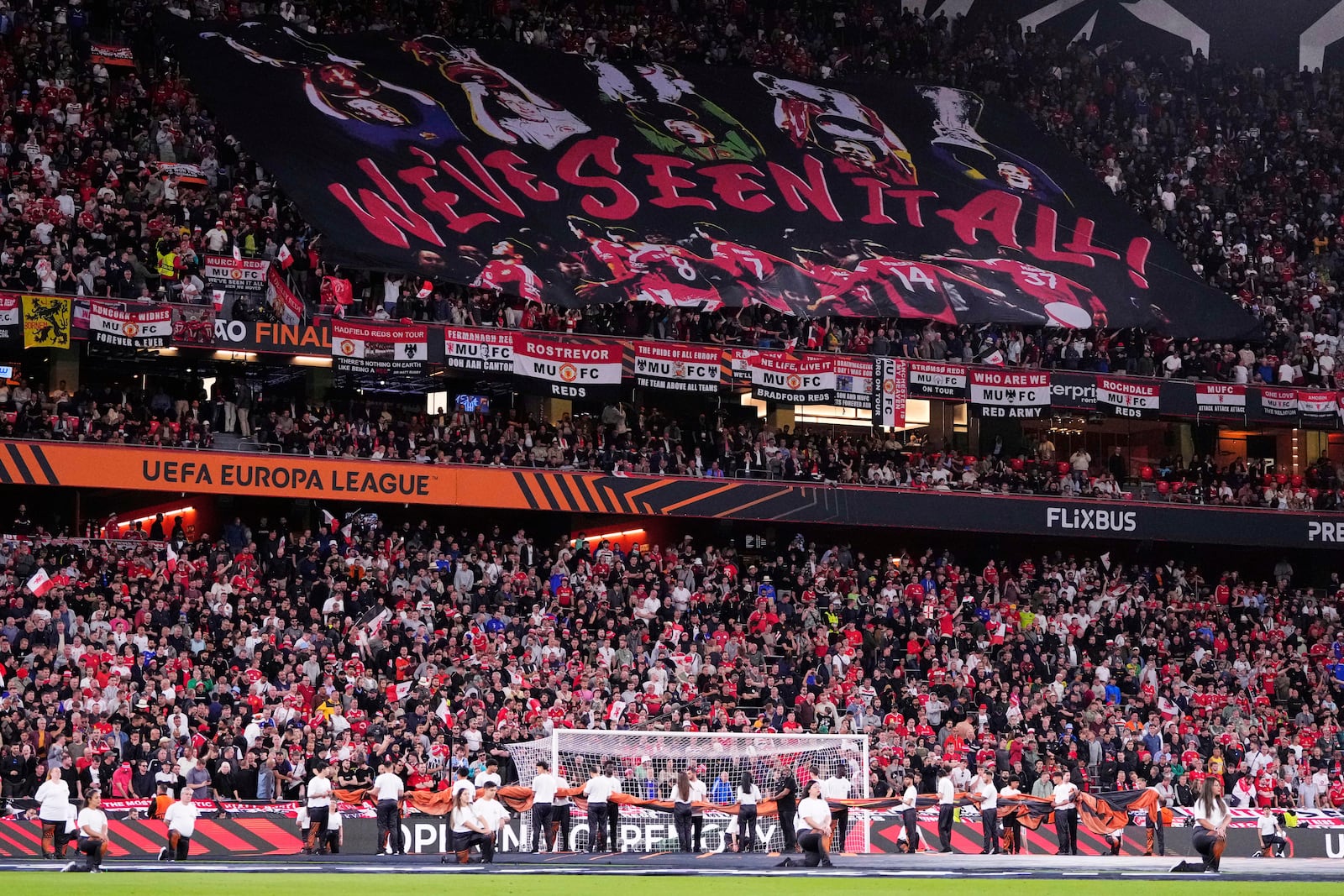 Manchester United fans cheer during the Europa League final soccer match between Tottenham Hotspur and Manchester United at the San Mames Stadium in Bilbao, Spain, Wednesday, May 21, 2025. (AP Photo/Jose Breton)