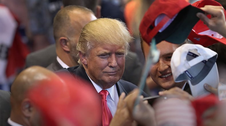 SCRANTON, PA - JULY 27: Republican Presidential candidate Donald Trump signs autographs and poses for photos after his speech on July 27, 2016 in Scranton, Pennsylvania. Trump spoke at the Lackawanna College Student Union Gymnasium. (Photo by John Moore/Getty Images)