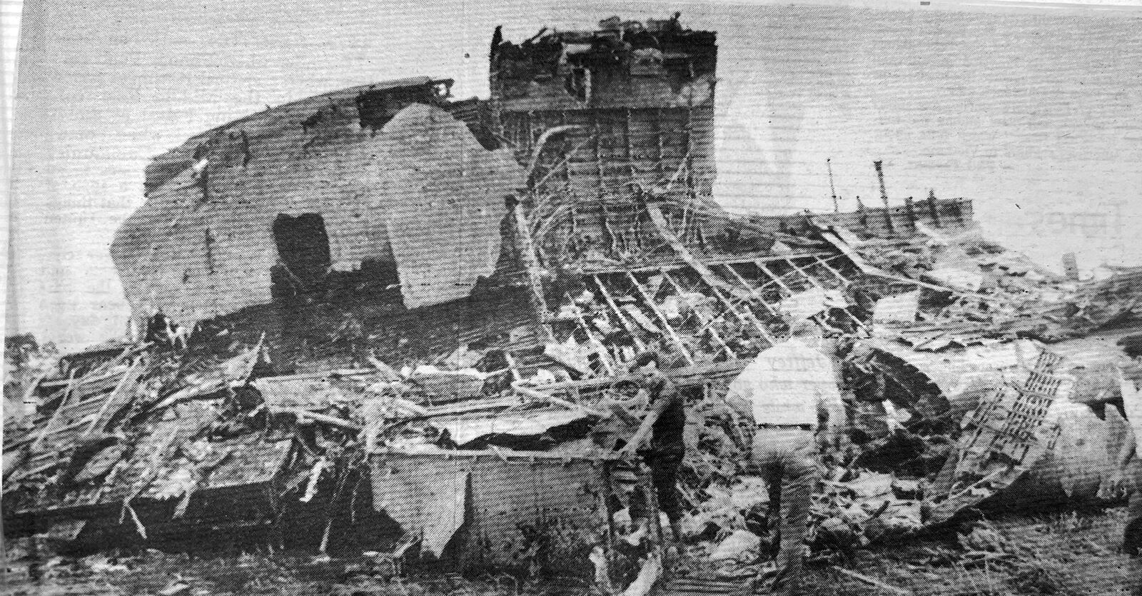 A newspaper clipping with a photo of the remains of the C5 A aircraft that crashed shortly after takeoff on April 4, 1975.