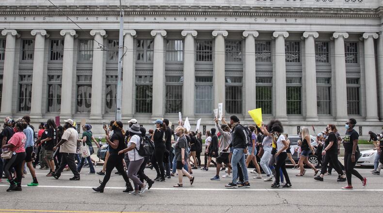 A protest event that began at the federal building in downtown Dayton on Saturday, May 30, 2020, moved to the area of Jones Street and Wayne Avenue, where police stopped marchers from entering U.S. 35 by using pepper spray balls and a line of officers. MARSHALL GORBY / STAFF