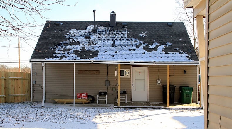 A door off the breakfast nook opens to the covered deck and patio. The wooden privacy fence was added a year ago and surrounds the back yard, which has a 2-car, detached garage and extra parking pad.