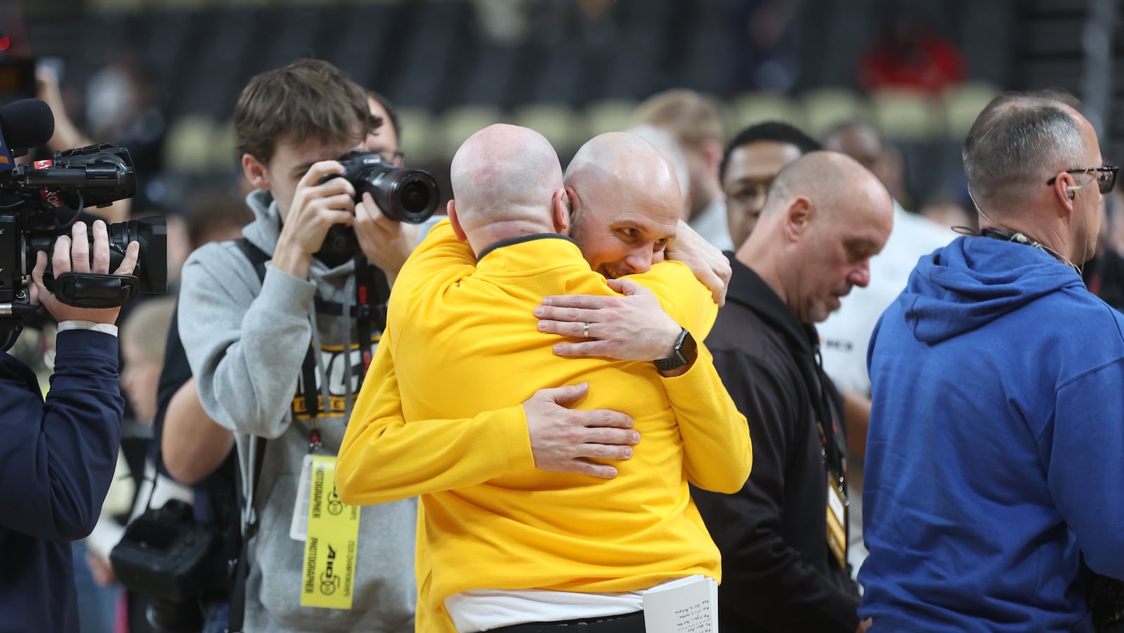 Virginia Commonwealth's Phil Martelli Jr., back, gets a hug after a victory against Dayton in the Atlantic 10 Conference championship game on Sunday, March 15, 2026, at PPG Paints Arena in Pittsburgh. David Jablonski/Staff