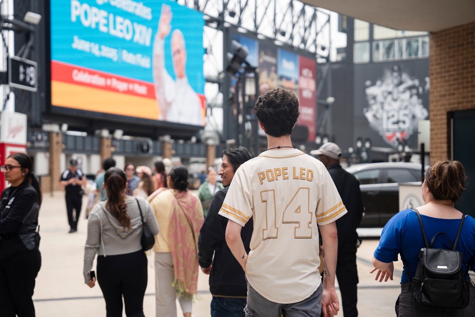 Ethan Peebles wears a Pope Leo jersey during the Archdiocese of Chicago's celebration of Pope Leo XIV at Rate Field, Saturday, June 14, 2025. (Pat Nabong/Chicago Sun-Times via AP)