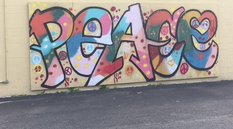 The East End Community Center in Dayton is teaming with the Dayton Art Society to bring artwork to create to help beautify the surrounding area. MALIK PERKINS/STAFF
