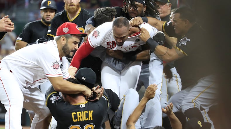 Amir Garrett (middle white shirt without hat) of the Cincinnati Reds engages members of the Pittsburgh Pirates during a bench clearing altercation in the 9th inning of the game at Great American Ball Park on Tuesday, July 30, 2019 in Cincinnati. (Photo by Andy Lyons/Getty Images)