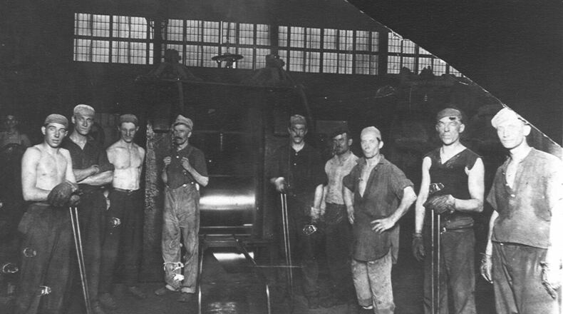 1914 - Roller and crew at Armco: From left, watcher Floyd Ruhle, rougher Jim Walters, catcher Art Lord, heater Jerry Mincher, roller William Moorhead, unknown, heater helper William Lockhard, doubler Ed Moorman and pair heater Hughie Evers. Contributed Winifred Nardiello