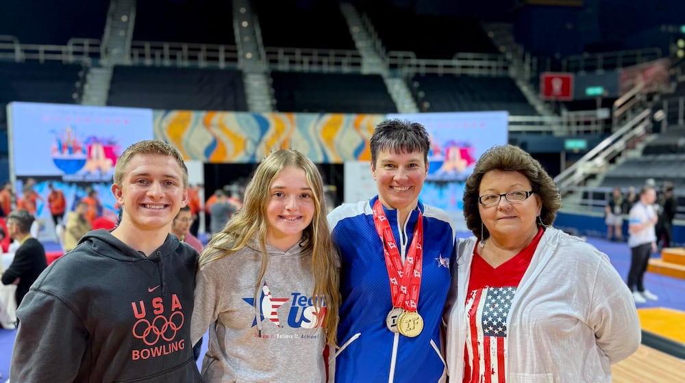 Shannon Pluhowsky celebrates her multi-medal performance at the IBF World Championships in Hong Kong with her family. CONTRIBUTED