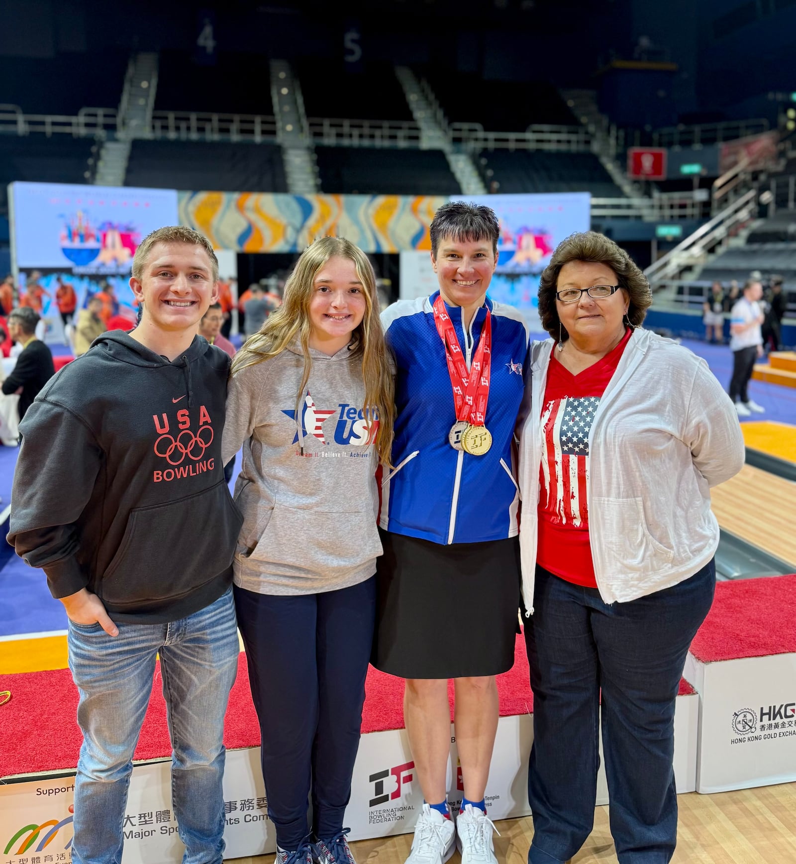 Shannon Pluhowsky celebrates her multi-medal performance at the IBF World Championships in Hong Kong with her family. CONTRIBUTED