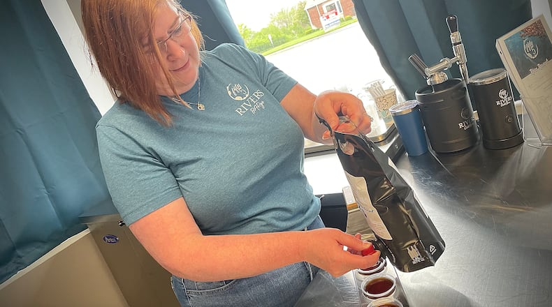 Fifty5 Rivers Cold Brew is located at 644 N. Broad St. in Fairborn. Pictured is owner Lynne Mowery pouring cold brew samples. NATALIE JONES/STAFF