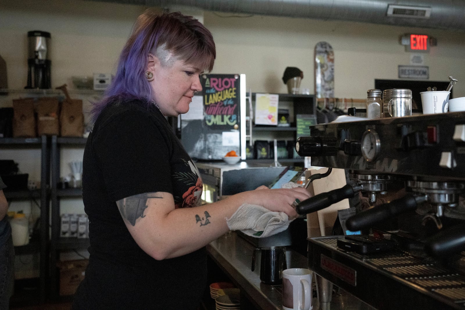 Renee Colon, co-owner of Fuego Coffee Roasters, uses a coffee machine, Saturday, March 22, 2025, in Rochester, N.Y. (Max Conway via AP)