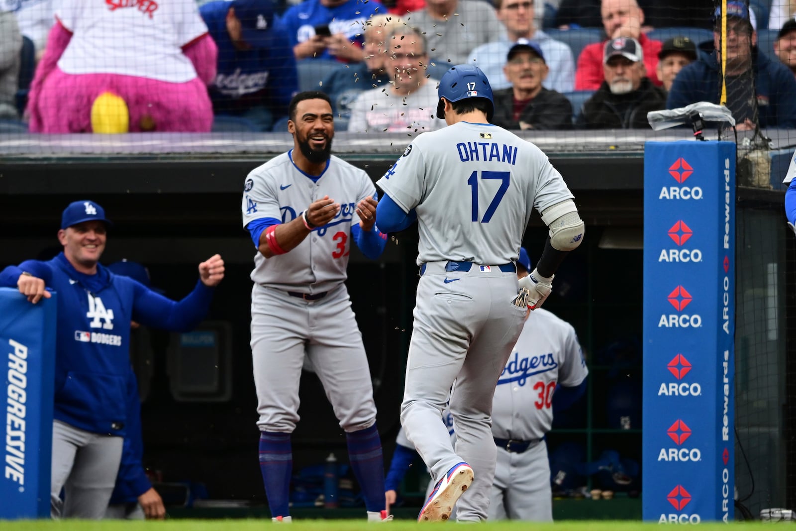 Los Angeles Dodgers' Shohei Ohtani is congratulated by Teoscar Hernandez after hitting a two run home run off Cleveland Guardians starting pitcher Tanner Bibee during the fourth inning of a baseball game, Tuesday, May 27, 2025, in Cleveland. (AP Photo/David Dermer)