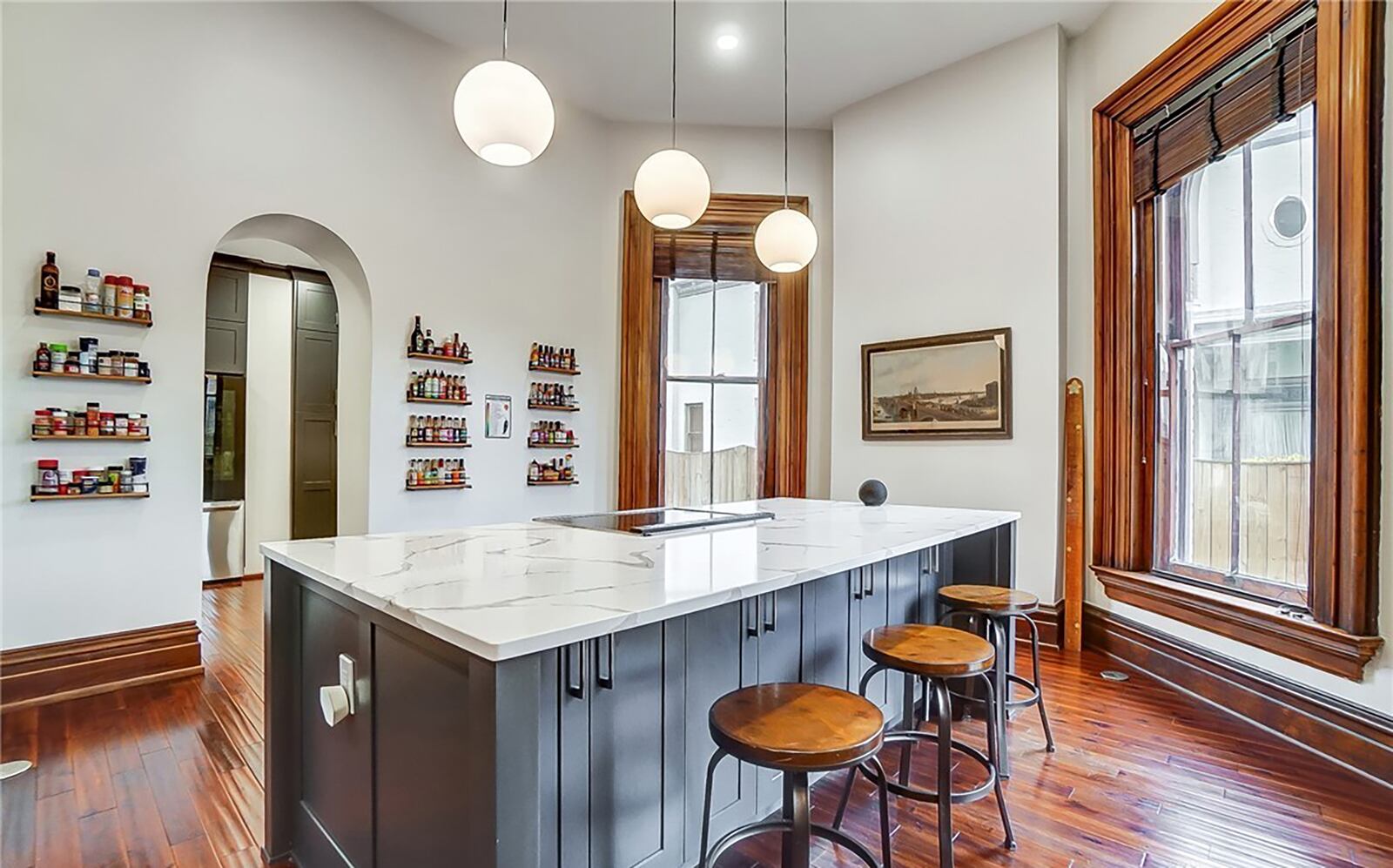 The all new kitchen features this island with marble top and built in range.