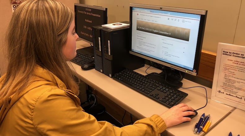 An Oakwood High School student checks her online College Credit Plus English class at Sinclair Community College. JEREMY P. KELLEY / STAFF