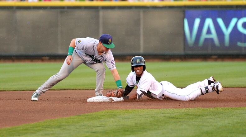 Dayton’s Jeter Downs attempts to go for second off a single to left field Wednesday night against the Cedar Rapids Kernels. Christine Bates/CONTRIBUTED