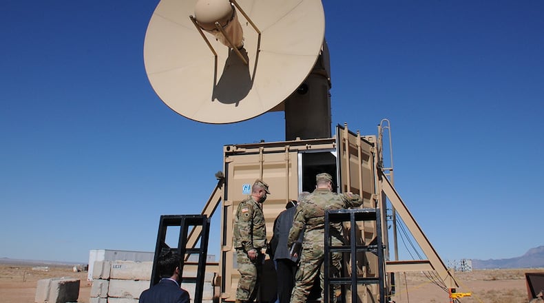 Leaders from the Army Rapid Capabilities and Critical Technologies Office enter the portable control center of Air Force Research Laboratory’s Tactical High Power Operational Responder, or THOR, to view the system’s drone-killing capabilities Feb. 11 at Kirtland Air Force Base, N.M. THOR is a prototype directed energy weapon used to disable the electronics in drones, and specifically engineered to counter multiple targets – such as a drone swarm – with rapid results. U.S. AIR FORCE PHOTO/JOHN COCHRAN