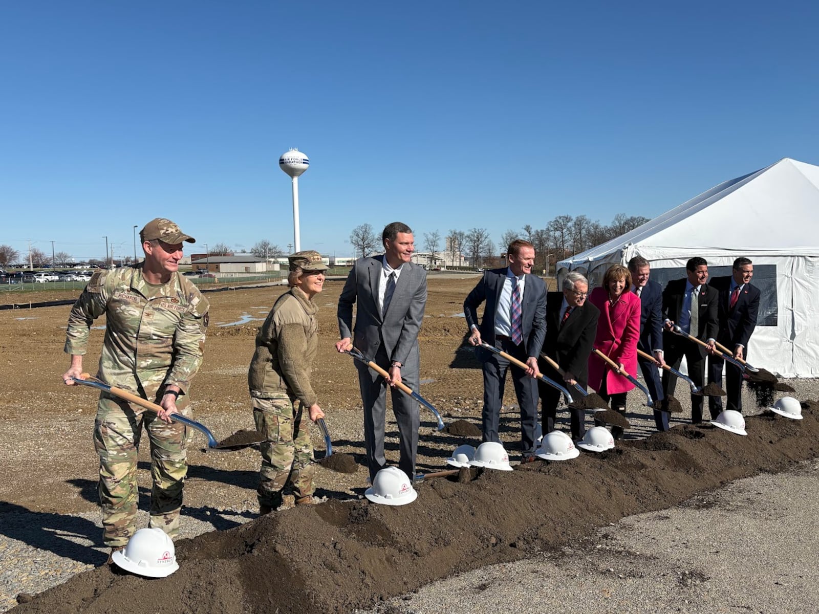 Business, Air Force and elected officials ceremonially throw dirt on "Stratos Hilltop" on Wright-Patterson Air Force Base off National Road on Thursday, March 12, 2026. THOMAS GNAU/STAFF WRITER