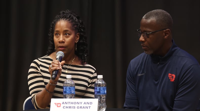 Chris Grant, left, speaks at The Spotlight Town Hall, a mental health event, on Wednesday, Oct. 9, 2024, at UD Arena in Dayton. David Jablonski/Staff