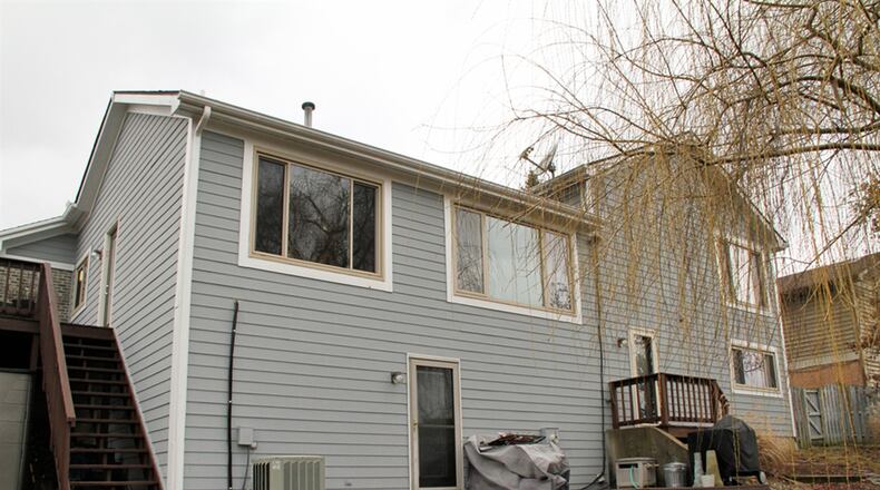 A balcony desk is accessible from the kitchen while a second deck is accessible from the semi-finished basement. Picture windows are within every room of the house, allowing for natural light on all levels.
